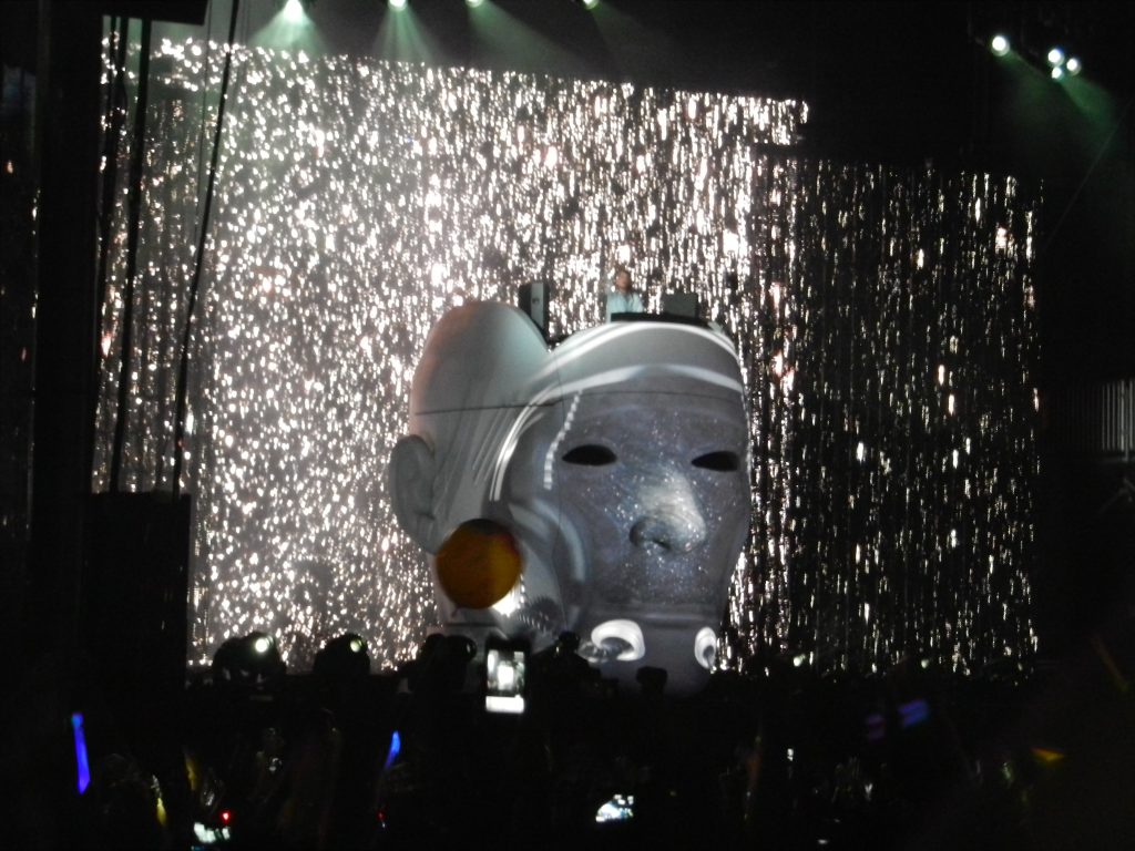 Avicii performing live, the kind of festival stage where Enough Is Enough became an anthem