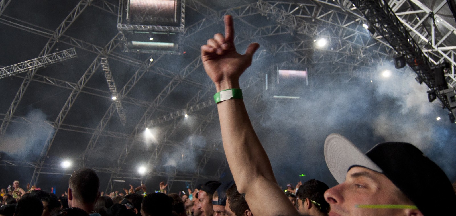 Crowd with hands up at a rave as Gen Z drinking less reshapes nightlife