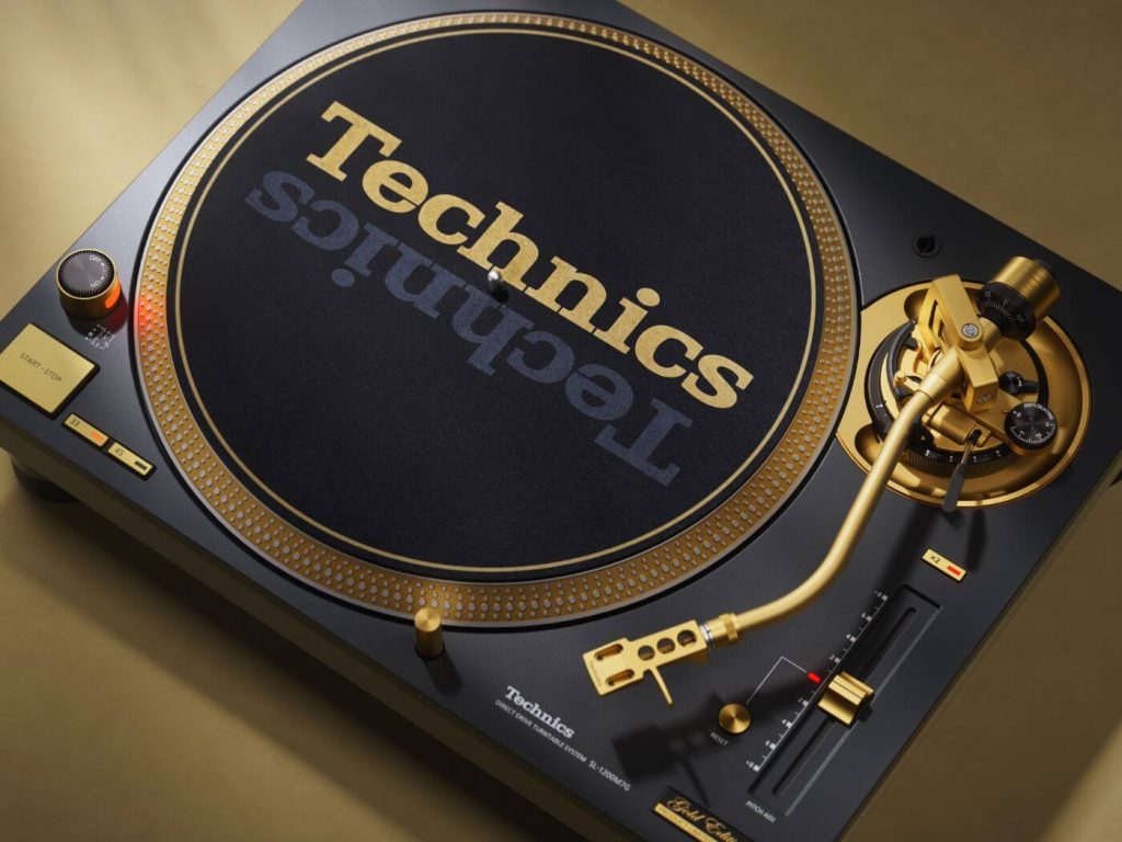 Close up of the Technics SL-1200 55th Anniversary Edition tonearm and gold detailing in black