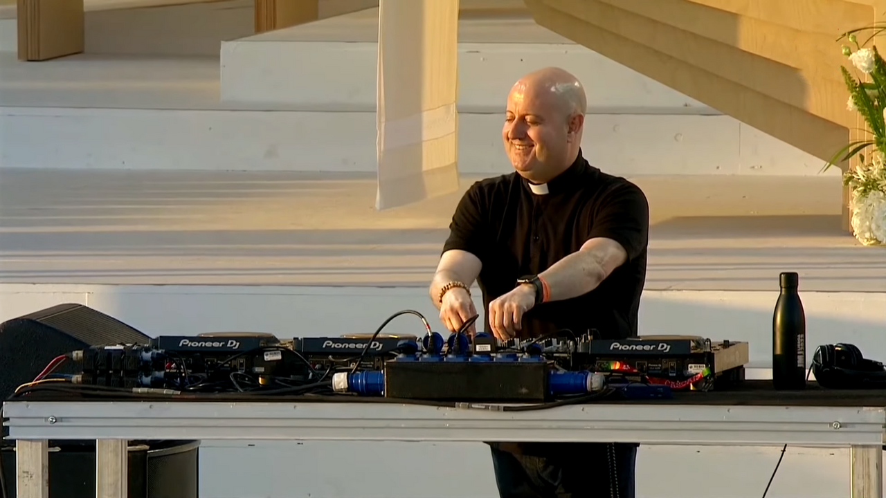 Padre Guilherme playing a DJ set at World Youth Day in Lisbon in 2023