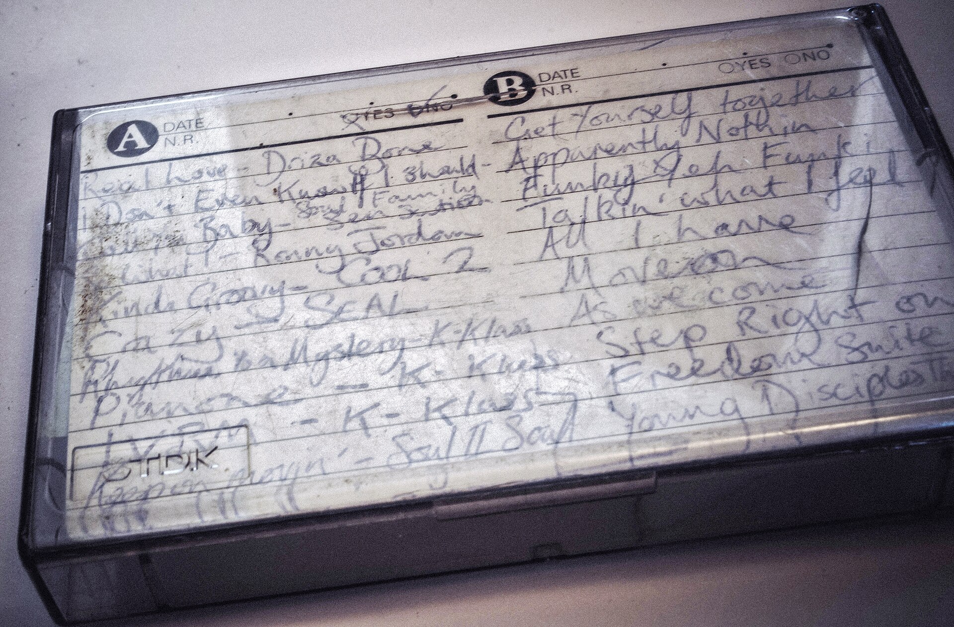 Handwritten mixtape tracklist with house and soul records from the early nineties