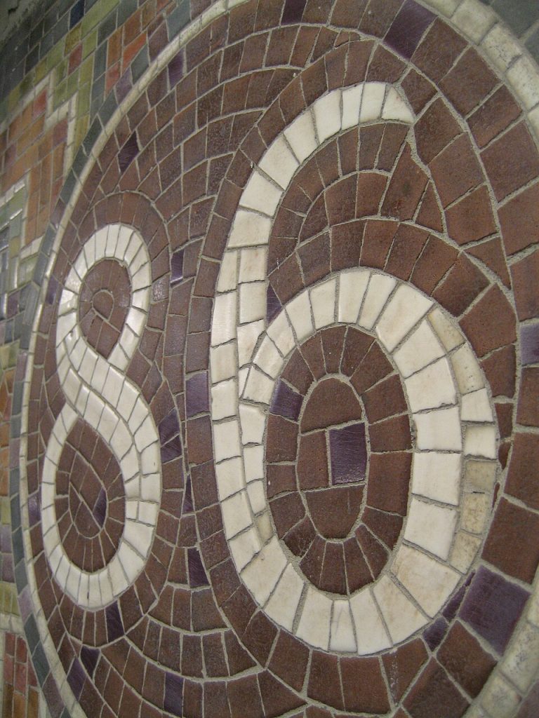 Wall mosaics at the 86th Street subway station on the Lexington Avenue Line, where Damon C. Scott sings