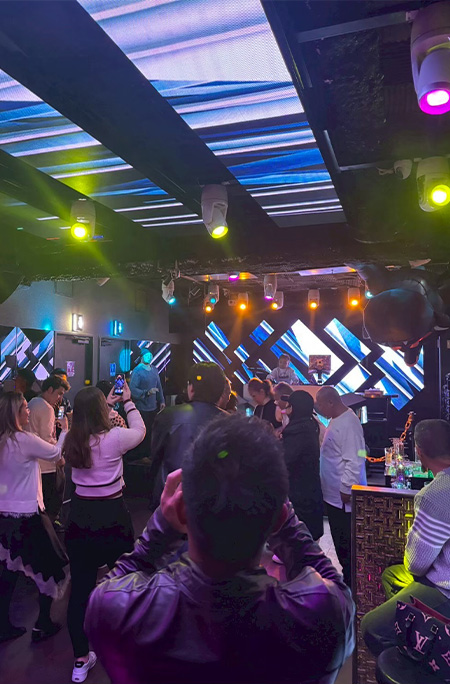 Clubbers filming DJ ILLU during her record setting club set