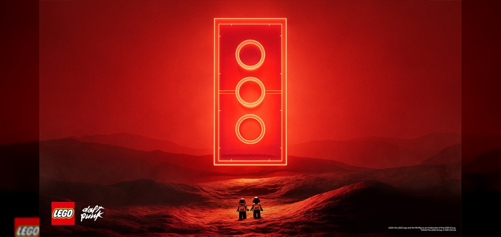 Daft Punk LEGO partnership key art with the robot minifigures and a red LEGO brick