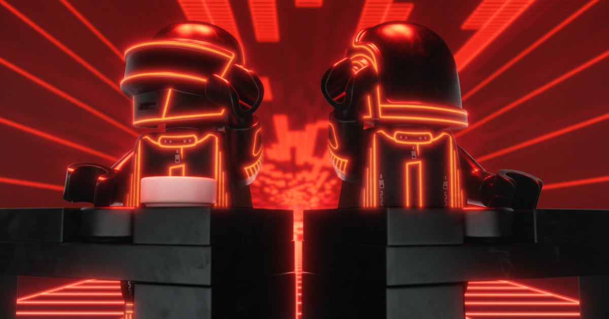 Daft Punk LEGO minifigures behind a brick built console in the announcement film