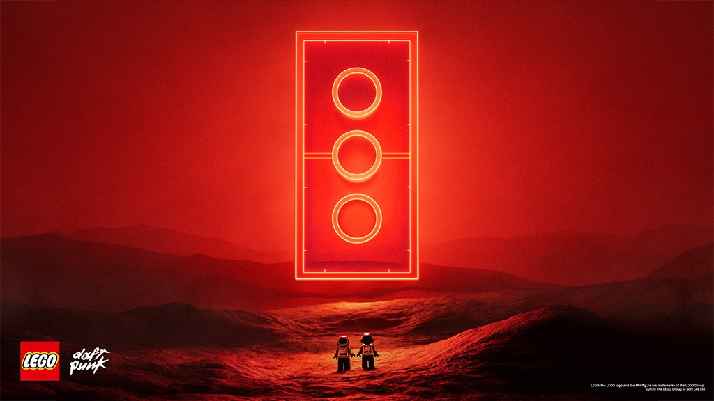 Daft Punk LEGO partnership key art with the two robot minifigures facing a glowing red brick