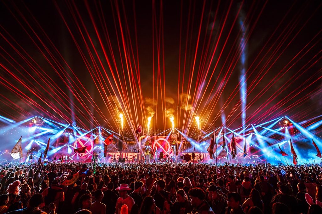 Lasers and pyrotechnics over the crowd at Escape Halloween in San Bernardino