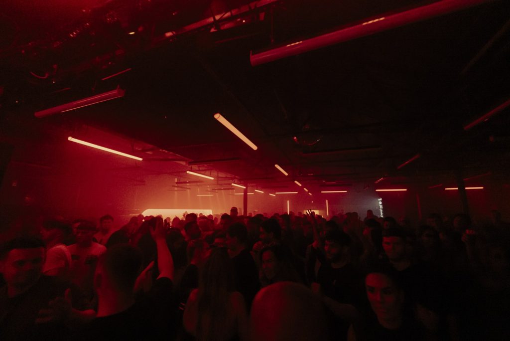 A packed dancefloor at Sankeys Manchester under red light