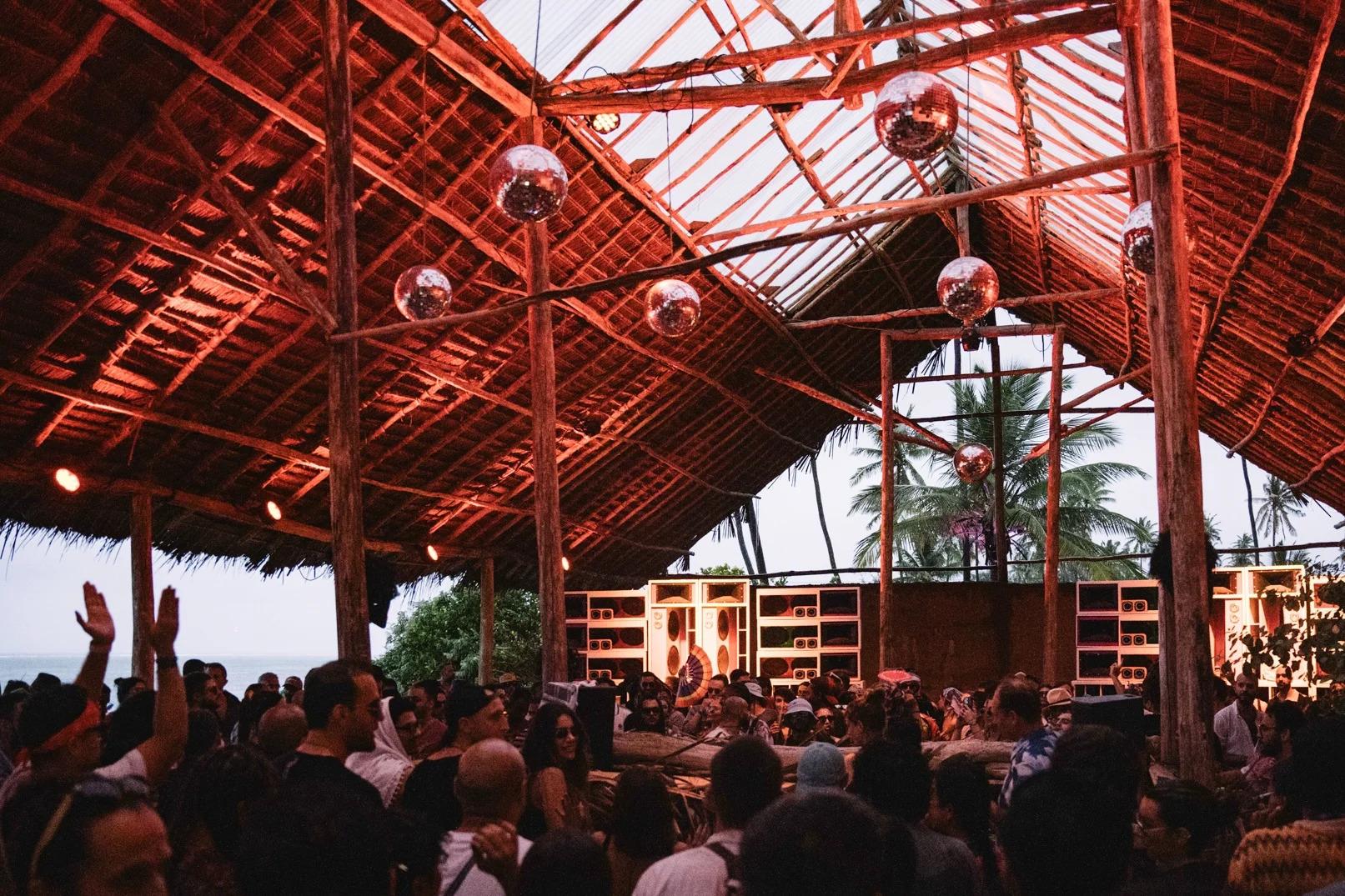 Crowd under the wooden roof at Soundscapes festival in Zanzibar