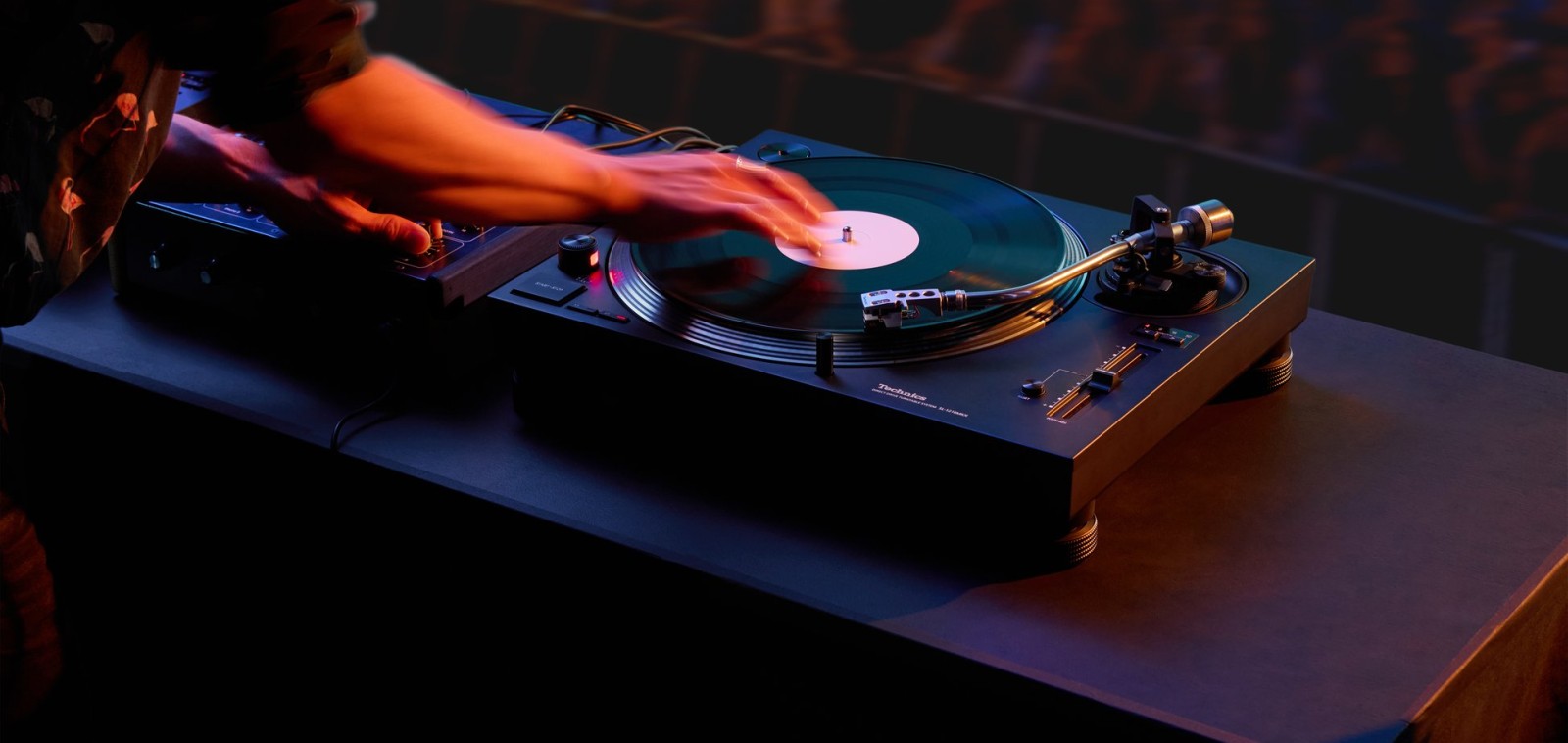 Technics SL-1210MKX turntable in a DJ booth