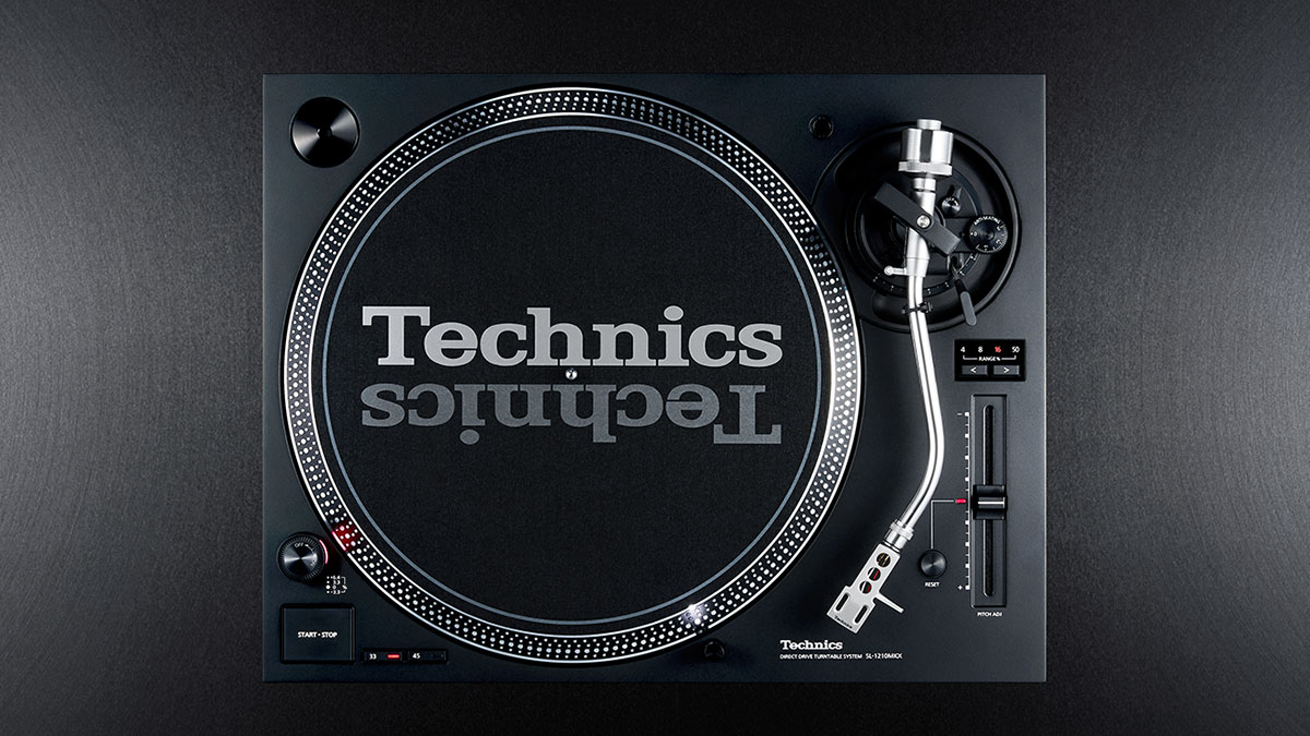Technics SL-1210MKX top view showing pitch fader and silver tonearm